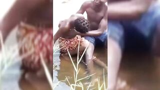 Kenyan Man In The Stream With Girlfriend