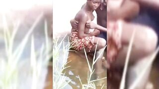 Kenyan Man In The Stream With Girlfriend