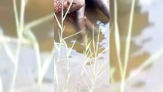 Kenyan Man In The Stream With Girlfriend